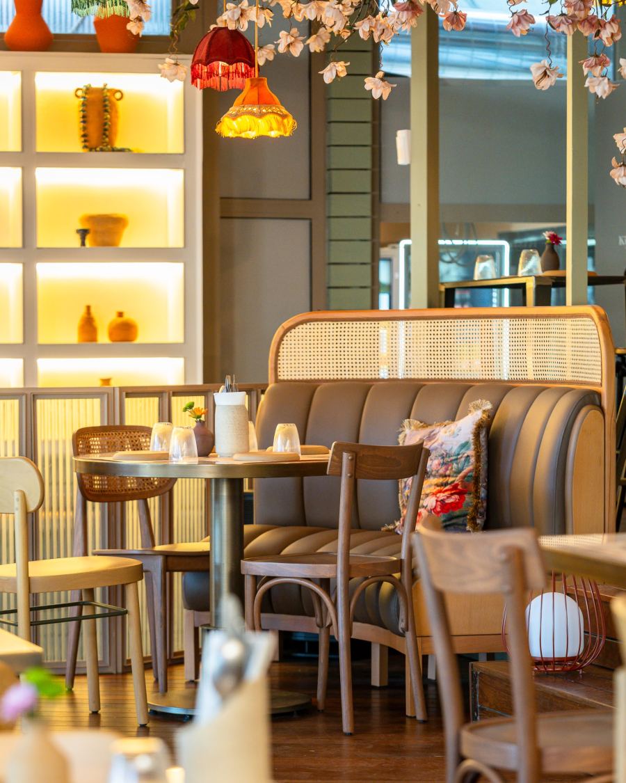 Kish-Mish dining room with banquette and warm lighting